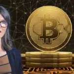 Cathie Wood Cuts Down Coinbase's Stake as Bitcoin Holds $56k High